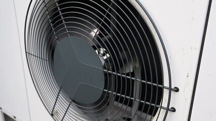 Heat pump fan spinning on an outdoor unit