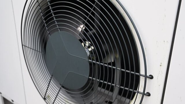 Heat pump fan spinning on an outdoor unit