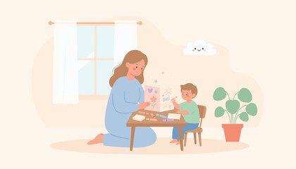 Fototapeta premium Mother and son happily crafting greeting cards at home expressing love and creativity