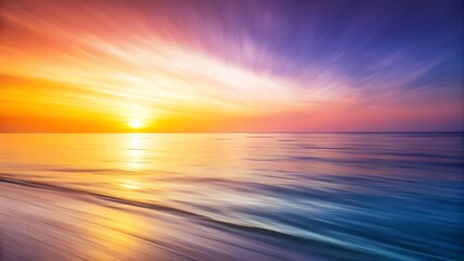 Vibrant sunset over the ocean with dramatic light rays and motion blur