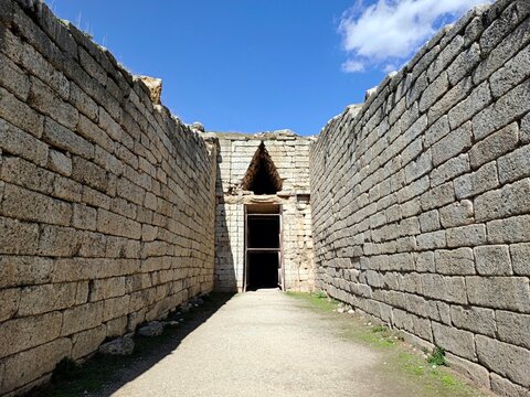 Photo of the entrance to the Tomb of Clytemnestra, a grand Mycenaean tholos tomb dating to c. 1250 BC, built for Agamemnon&rsquo;s wife at the archaeological site of Mycenae in Peloponnese, Greece.