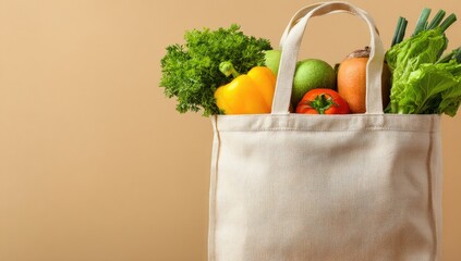 A beige canvas tote bag filled with colorful produce, including peppers, apples, tomatoes, and leafy greens.