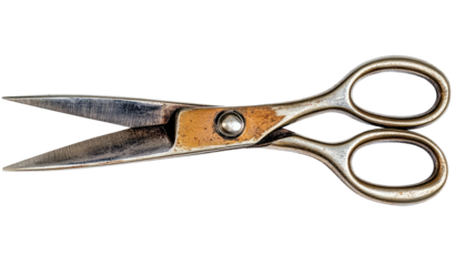 Metal scissors open, showing wear, rivets, and aged texture on black background