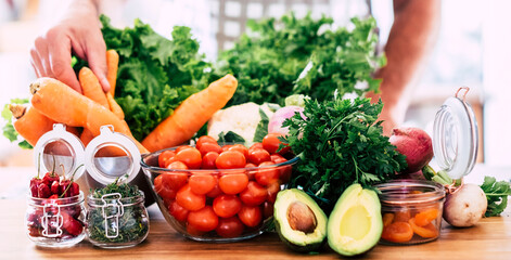 Fresh colorful fruits and vegetables displayed or being cut and prepared, symbol of healthy eating,...