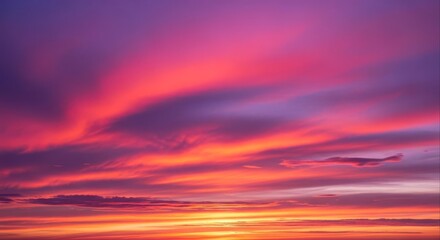 Obraz premium Spectacular vibrant sunset sky with dramatic clouds painted in hues of purple, pink, and gold