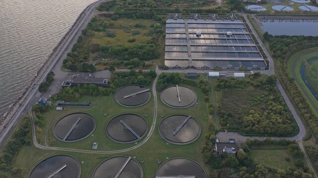 Aerial of sewage plant basins, wastewater ponds and recycling system.