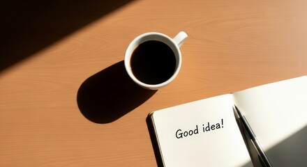 Notebook with good idea message, pen and coffee cup on wooden table. Creativity and inspiration concept for business, study, and daily planning.
