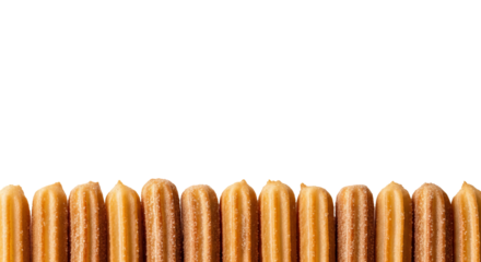 Row of freshly baked churros are positioned side by side against a contrasting isolated background.