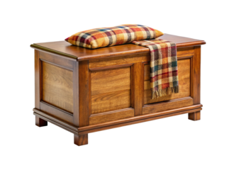 Antique wooden blanket chest with decorative accents and folded textile on top