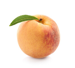 Peach with leaves in closeup on white background
