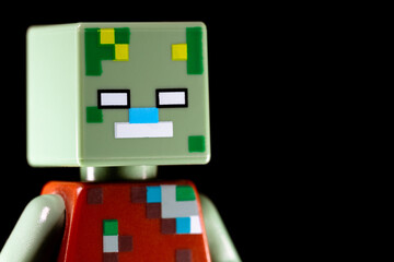 Naklejka premium Side view of LEGO Minecraft Drowned face on a black background