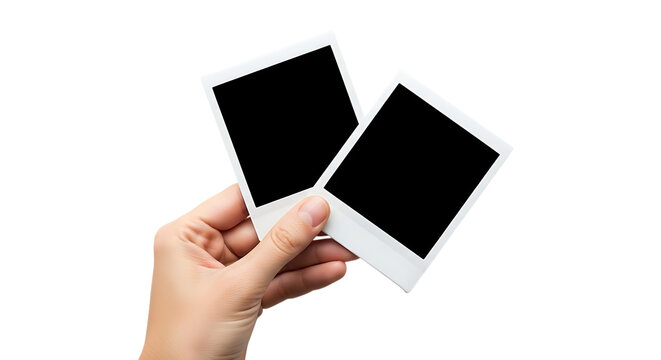Hand holding two blank instant photos memories and capturing moments