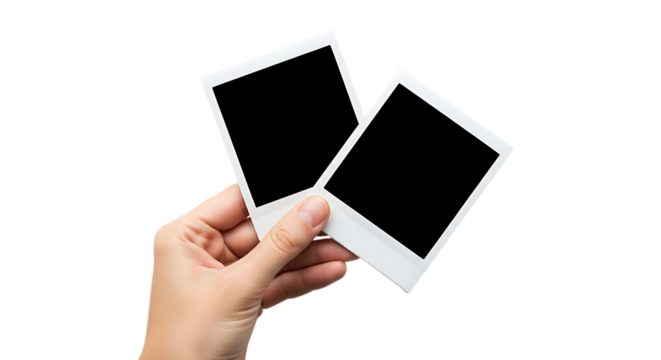 Hand holding two blank instant photos memories and capturing moments