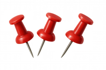 Red pushpins holding message or note onto a corkboard, using office supplies for communication and organization