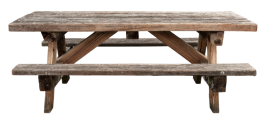 A rustic, wooden picnic table, showcasing the aged grain with bench seating and support beams