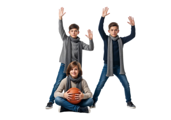 Playful children posing with basketball and raised arms