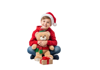 Smiling child with teddy bear and Christmas gift box