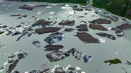 Floating icebergs in Alaska glacier lagoon aerial view. Floating icebergs in Alaskan glacier lagoon...