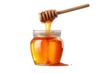 Golden amber liquid being drizzled from a wooden dipper into a glass jar