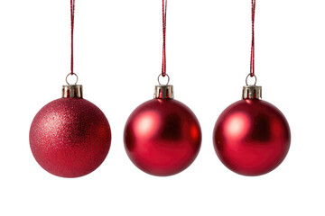 Three vibrant red Christmas baubles, each with a silver cap and hanging ribbon against a black backdrop