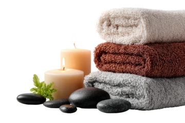 A spa-themed composition with towels, candles, and dark stones