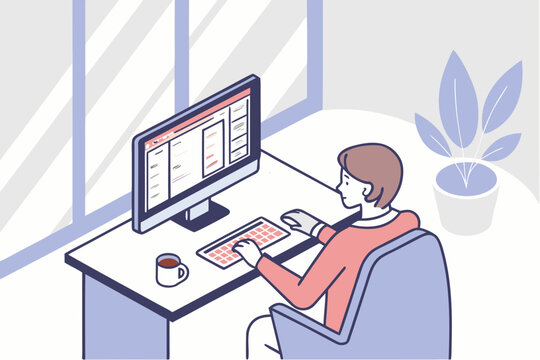 Person designing and coding a website at a computer