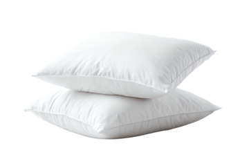 Two fluffy, white square pillows stacked on each other against a stark black background