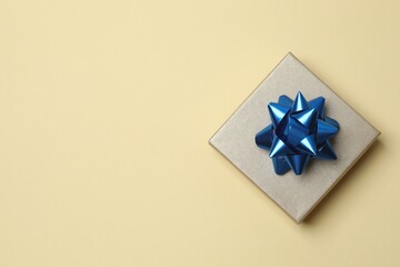 Bright gift box on color surface