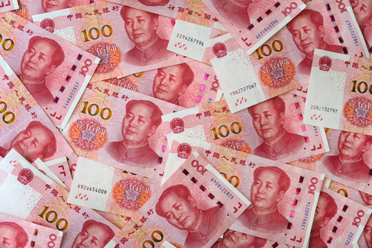 background of money. currency of PBOC or people's bank of china. One hundred CNY Chinese yuan bill. 100 rmb or renminbi, depicts Beijing economy system, public banking policy and interest rate
