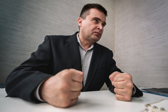 Dealing with anger at work. strict boss feel anger at work. Businessman show fist in anger. Anger managements. Managing stress. Tame your temper. Stay in control Business problem and conflict.