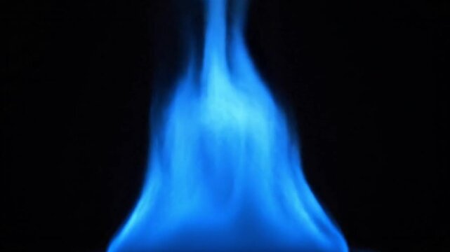 A mesmerizing blue flame rises and dances dynamically against a stark black background, showcasing the intense heat and pure energy of clean-burning gas. The vibrant cerulean light illuminates the dar