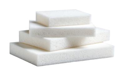 Four white, porous foam blocks stacked in a diminishing size pyramid shape