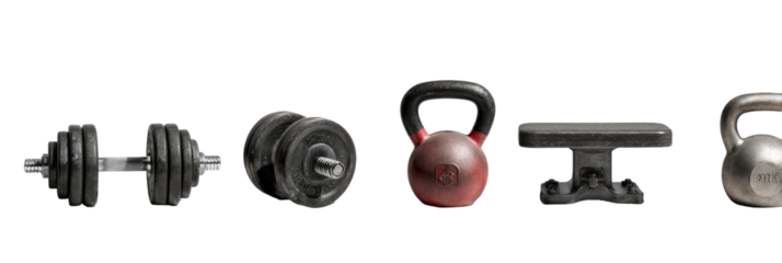 A collection of exercise equipment dumbbells, kettlebells, and a small weight platform against black
