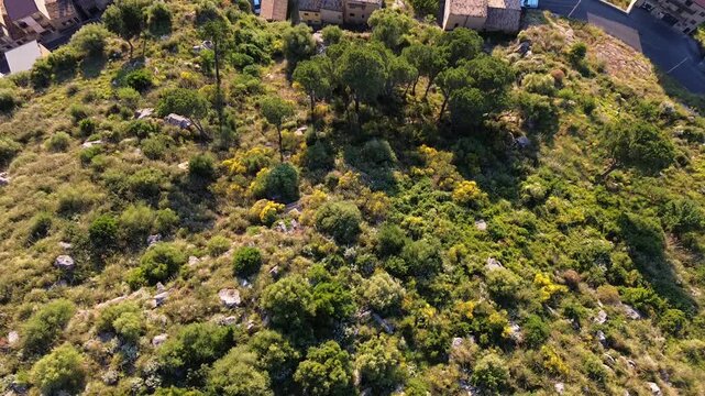 Aerial Drone View Of Collesano Town With Mountains And Sunset In Sicily, Italy.