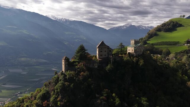 Juval castle, castle on a mountai nridge overlooking a lagre apple orchard vally. Alps of Tirol. Italy.