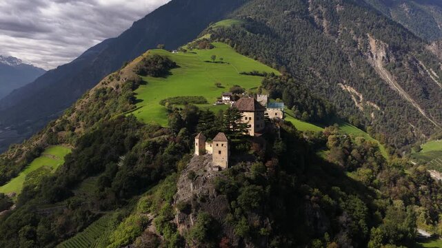 Juval castle, castle on a mountai nridge overlooking a lagre apple orchard vally. Alps of Tirol. Italy.