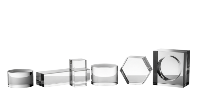 Collection of geometric transparent acrylic blocks in various shapes, isolated on a transparent background