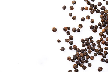 Black peppercorns on white background