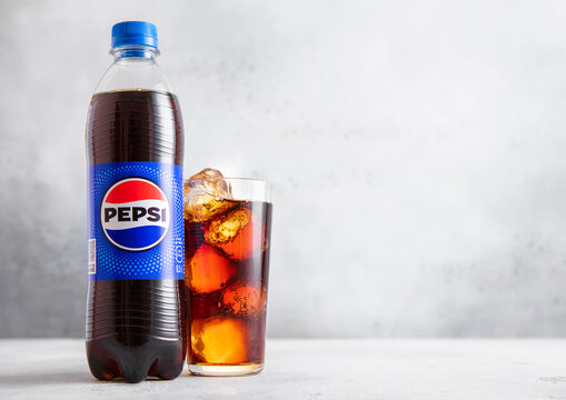 LONDON,UK - JUNE 21, 2025: Bottle of Pepsi Cola Original soda soft drink on light table background.