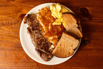 Steak, eggs, hash browns and toast