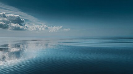 Serene seascape with calming blue water reflecting soft clouds, perfect for travel blog or mindfulness meditation background, evokes peace and tranquility
