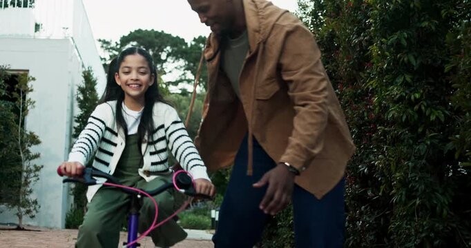 Teaching, parents or child on bicycle with photo for cycling, childhood memory or laugh in driveway. Interracial family, dad or kid learning to ride bike by home with guidance, picture or development
