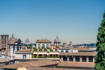 Fototapeta premium Rome Italy roofs church architecture. Italian blue sky copy space background