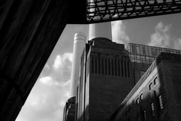 Black and white architectural view of Battersea Power Station with dramatic light and shadow in London, England