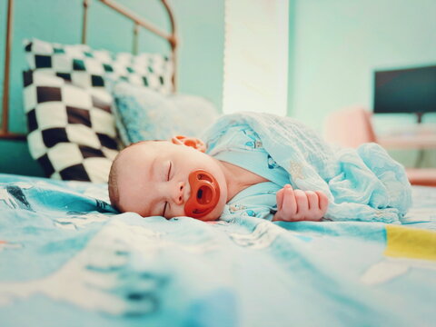 baby lying on the bed