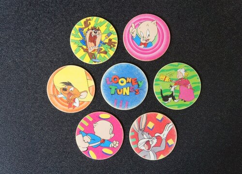 Tazos Collection on Black Background. 
