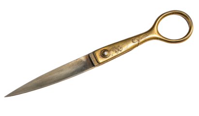 Antique gold scissors with ornate handles on a dark background