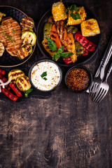 Assortment of grilled bbq meat and vegetables