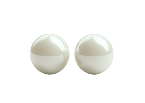 Two smooth, shiny, off-white orbs presented against a stark black backdrop