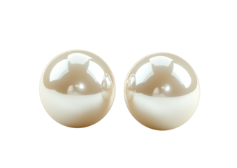 Two lustrous, cream-colored pearl earrings on black. Simple, elegant, and serene